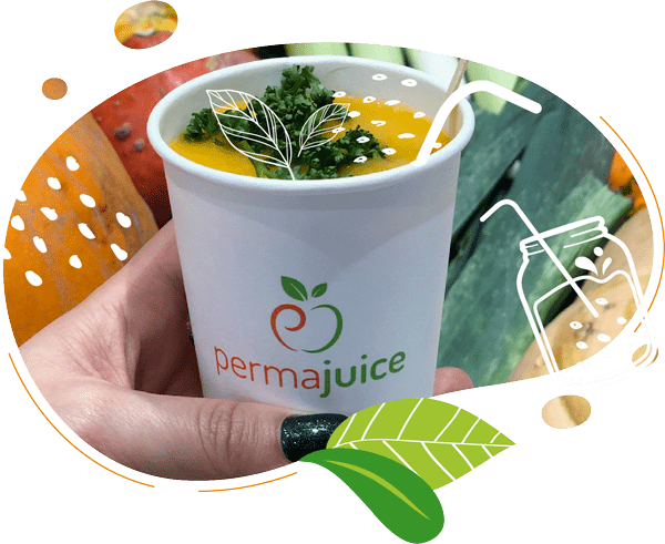 Cette photo de gobelet compostable contient une soupe avec un topping de persil frais
